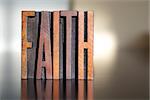 The word FAITH written in vintage wooden letterpress type