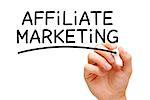 Hand writing Affiliate Marketing with black marker on transparent wipe board.