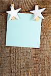 Clothes-peg in shape of star on old wooden background