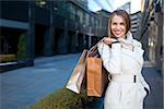 Young girl with shopping bags outdoors