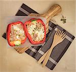 bell pepper stuffed with rice, tuna fish, olives, cheese, and fresh herbs