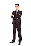 Confident businessman standing arms crossed