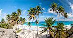 Bottom Bay is one of the most beautiful beaches on the Caribbean island of Barbados. It is a tropical paradise with palms hanging over turquoise sea. Wide panoramic photo