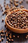 Coriander seeds in a bowl close-up.