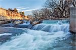 river dam diverting water for farmland irrigation, Cache la Poudre RIver in Fort Collins, Colorado, winter or early spring scenery