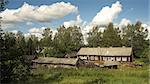 Russian North. Vologda region. Rural house with outbuildings. Typical housing for local residents.