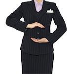 Woman in suit holding his hands before him. Crop