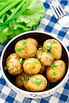 Potato with dill and scalliom in a bowl