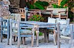 gray wooden furniture in an outdoor restaurant