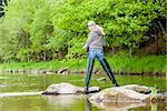 woman fishing in Sazava river, Czech Republic