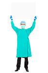 surgeon or checker in mask and holding white board