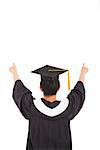 graduation man wearing a mortarboard and raised hands