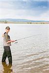 woman fishing in pond