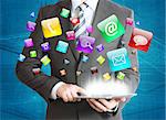 Man in suit holding tablet pc and application icons in hand. The concept of software