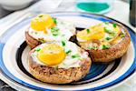 Baked stuffed mushrooms with eggs and herbs