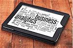 business analytics word cloud - a digital tablet on a rustic wooden table