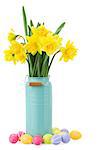 bouquet of yellow daffodils flowers in blue vase with easter eggs   isolated on white background