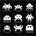 Vector white icons set of pixelated space invaders isolated on black background