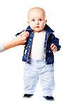 First steps. Baby learning to walk, with help of mothers hand