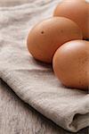 speckled chicken eggs or old table, rustic style