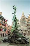 Antwerp's city hall with the Brabo fountain and with Belgian houses on the Great Market Square