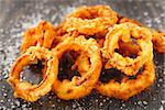 Homemade crunchy fried onion rings on a table