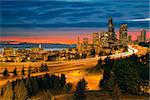 Seattle Washington City Skyline with Freeway Light Trails After Sunset