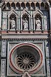 Facade detail of Basilica di Santa Maria del Fiore - famous cathedral church of Florence in Italy