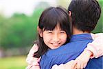 beautiful little girl hugging embracing her father