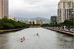Popular canoe racing along the Ala Wai canal close to Waikiki.
