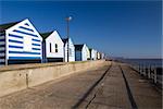 Beach huts at Southwold, Suffolk , England, against a blue sky