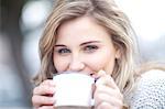 Young woman drinking coffee