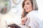 Young woman with diary and pen