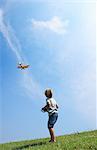 Boy flying model plane