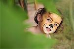 Girl with face painting of animal