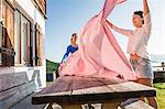 Two women preparing table, Tyrol, Austria