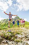 Group of friends jumping, Tyrol, Austria