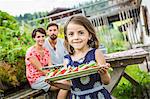 Young family preparing picnic lunch, Tyrol, Austria