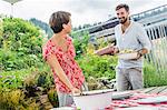 Young couple preparing picnic lunch, Tyrol, Austria