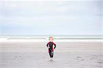 Boy running on beach