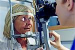 Female patient having eye tested in hospital