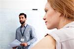 Young woman looking away in business meeting