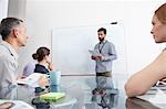 Businessman presenting to colleagues