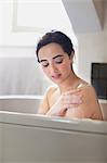 Portrait of serene young woman enjoying bath