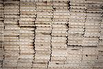 A reclaimed lumber workshop. Stacks of reclaimed, cleaned up planks of wood for re-use.