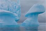 Icebergs with eroding and changing form drifting on the water, Antarctica