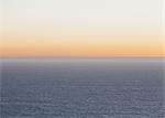 A view over the Pacific Ocean and the sunset on the horizon.