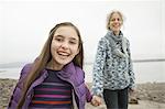 A day out at Ashokan lake. A mature woman holding hand with a young girl.