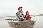 A day out at Ashokan lake. Two boys sitting fishing from a boat.