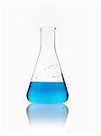 A conical scientific glassware flask partly filled with blue liquid.